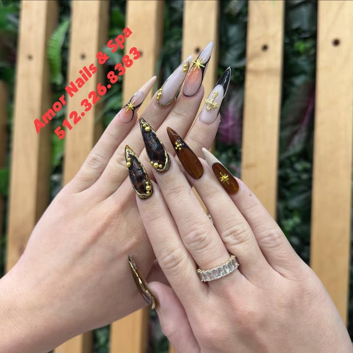 Tortoiseshell and gold cuffed stiletto nails, an Amor Nails and Spa branded photo