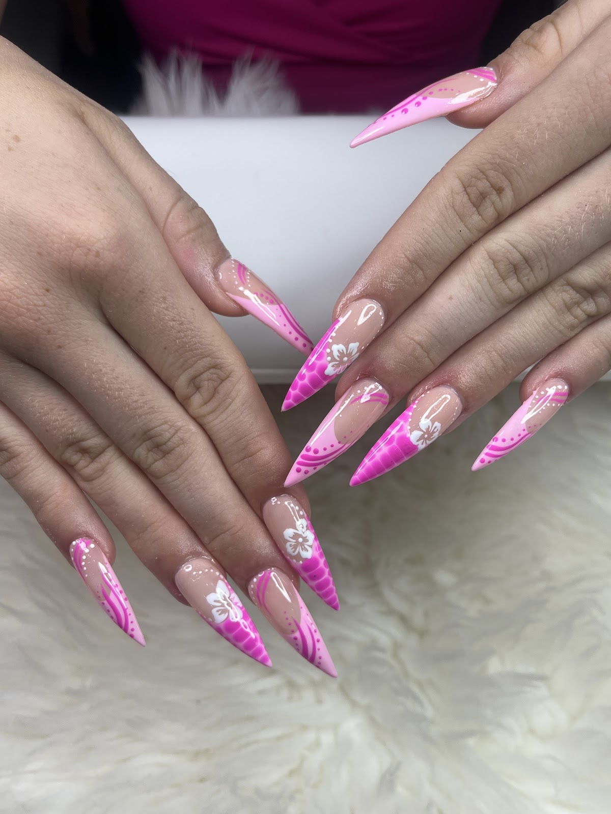Pink and nude stiletto nails with hand-painted hibiscus flower art